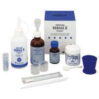 Rebase II Fast kit para prótesis dentales, incluye resina, endurecedor y herramientas para ajustes precisos en odontología, ideal para personalización y reparación de prótesis.