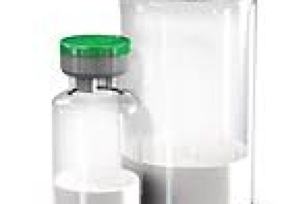 Advanced dental product containers with secure green lids, ideal for pharmaceutical and dental supplies.
